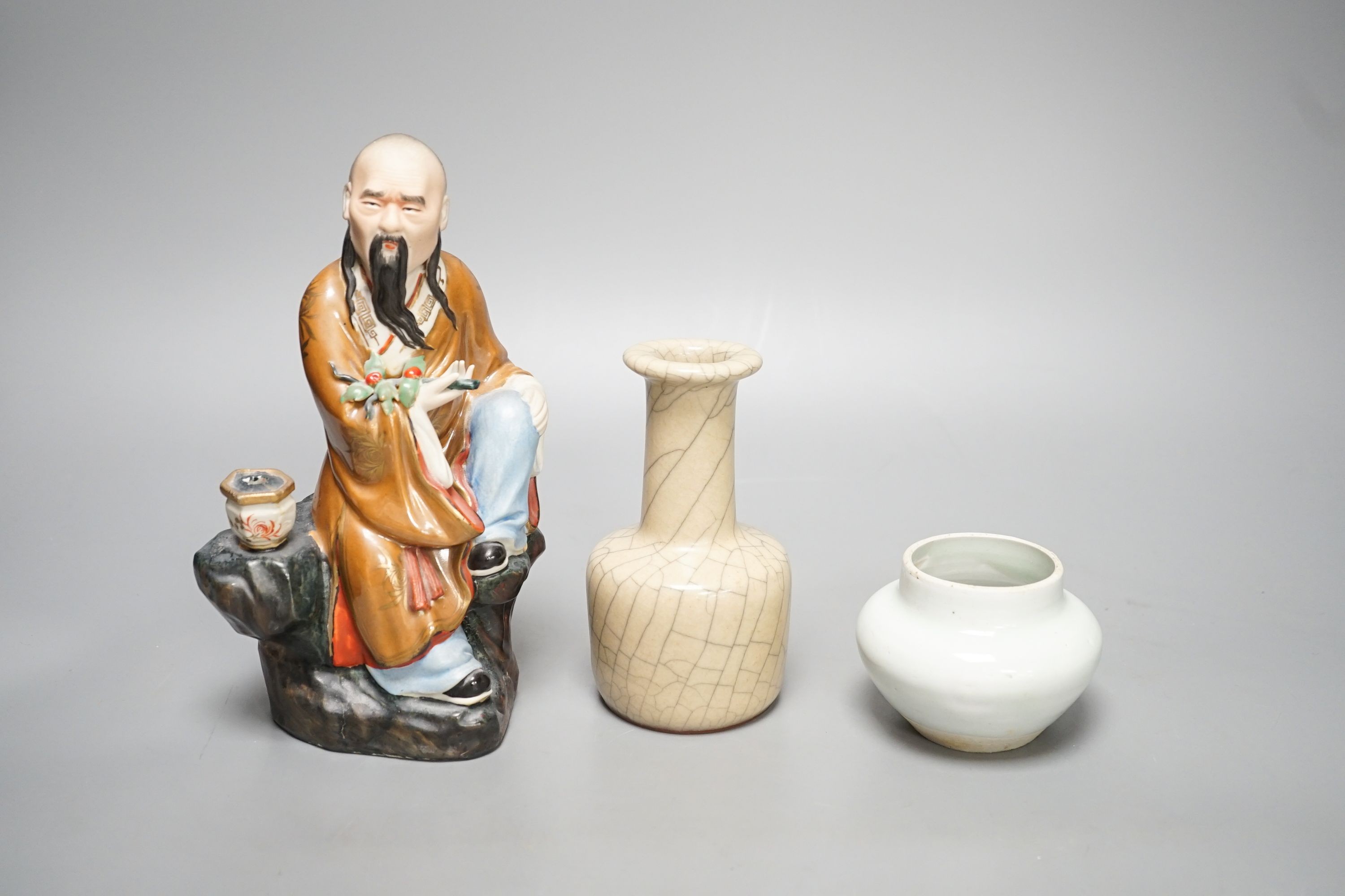 A Chinese porcelain figure, a crackleware jar and a monochrome water pot 20cm